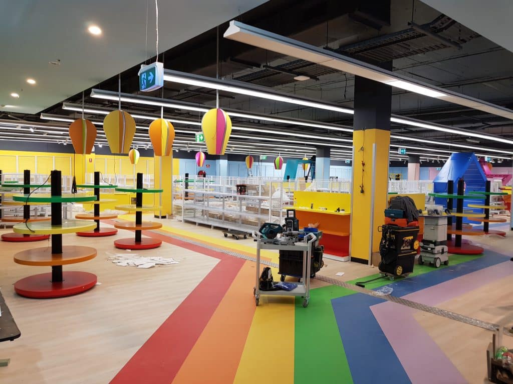 Colourful indoor commercial painting project in Sydney by Colourise Painting, featuring bright floor coatings, painted columns and professional finishes for high-traffic spaces.